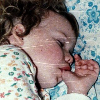 A child peacefully sleeping in a crib.