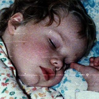 Baby sleeping peacefully in crib.
