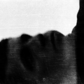 Silhouette of person in rain.