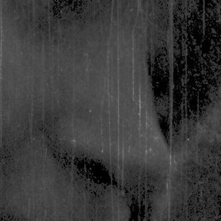 Silhouette of person in rain through window.