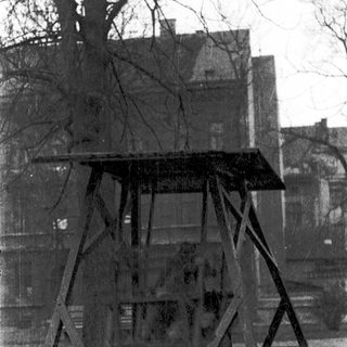 Abandoned guard tower with metal frame.