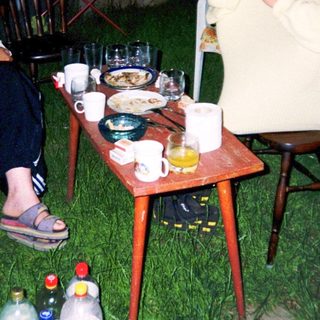 Two people enjoying outdoor evening meal together.