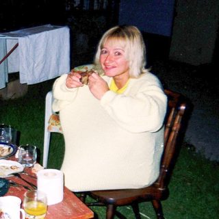 Two people enjoying outdoor evening meal together.