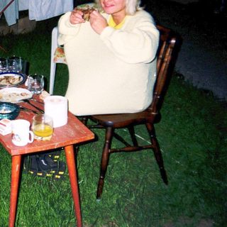 Two people enjoying outdoor evening meal together.