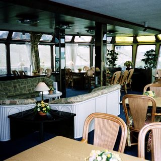 Luxurious indoor dining and lounge area on a cruise ship.