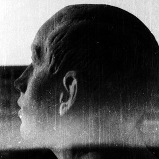 Sculpture of a contemplative profile in silhouette.