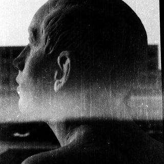 Sculpture of a contemplative profile in silhouette.