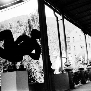Modern sculpture in outdoor architectural setting.