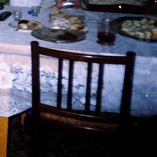 Family gathering in a cozy, indoor dining area.