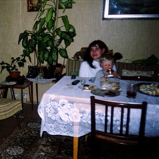 Family gathering in a cozy, indoor dining area.