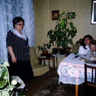 Family gathering in a cozy, indoor dining area.