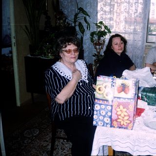 Family gathering around a festively set table.