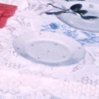 Family gathering around a festively set table.