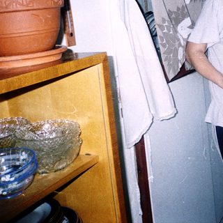 Person holding baked dish in kitchen.