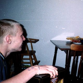 Two people playing video game indoors.