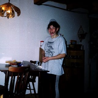Two people playing video game indoors.