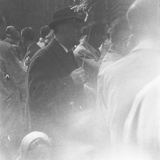 Street scene with man playing trumpet.