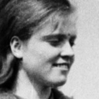 Young woman wearing 1960s-style coat and skirt.