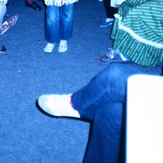 Children dressed in costumes playing indoors.