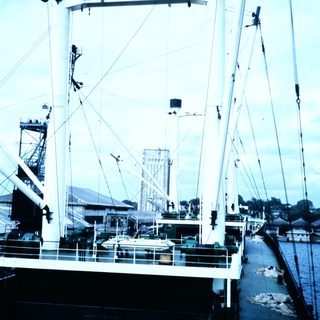 Large industrial ship docked at port.