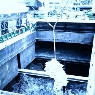 Large ship being built in dry dock.