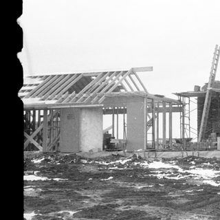 Construction site near waterfront during winter.