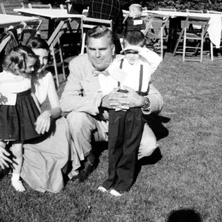 Family gathering at outdoor evening event.