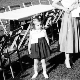 Family gathering at outdoor picnic setup.