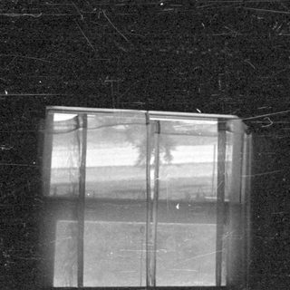 Window in lower left corner on damaged film.