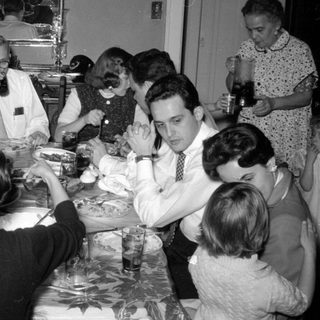 Group of people dining at a table.