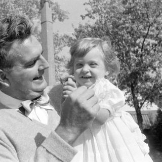 Man in bow tie and girl in white dress.