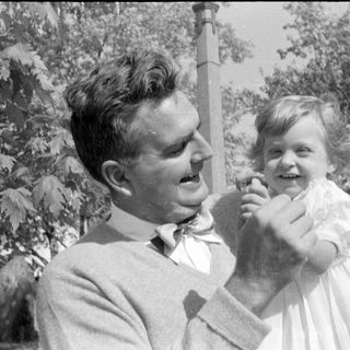 Man in bow tie and girl in white dress.
