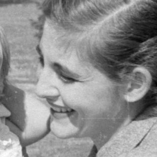 Woman and toddler in a park setting.