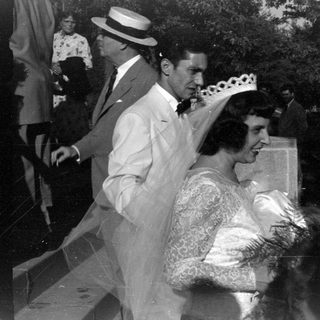 Wedding party in formal attire, black and white.