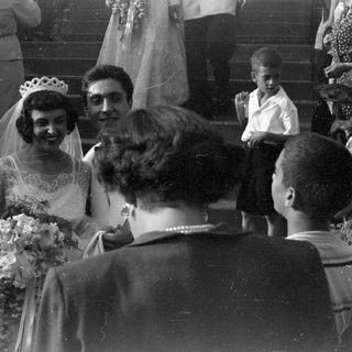 Bride with tiara and bouquet at a wedding.