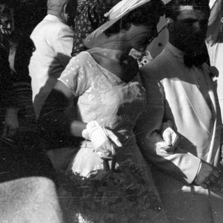 Group of people in formal attire outdoors.
