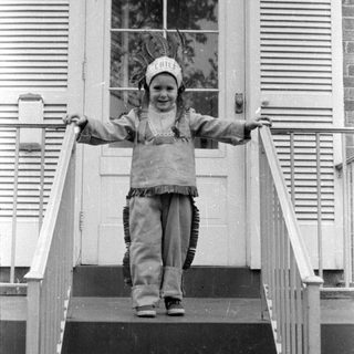Child in chief costume on stairs