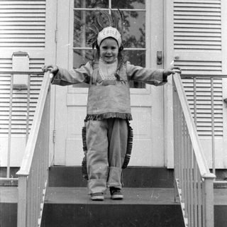 Child in chief costume on stairs
