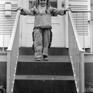 Child in chief costume on stairs