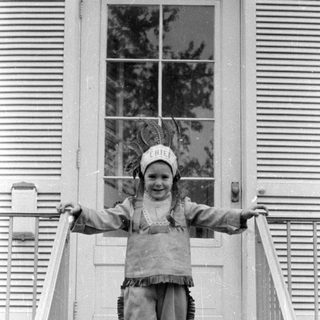Child in chief costume on stairs