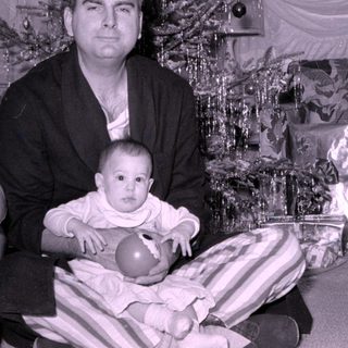 Mid-century Christmas portrait with man and baby