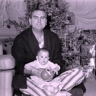 Mid-century Christmas portrait with man and baby