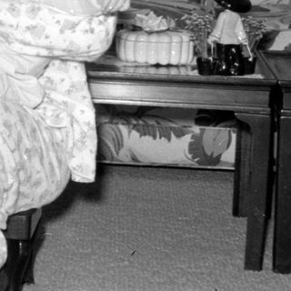 Woman and baby by Christmas tree