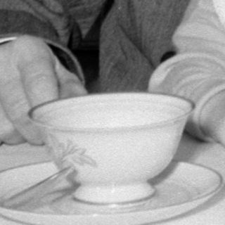 Man, baby, woman at table
