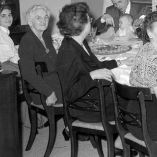 Family dinner scene, mid-20th century