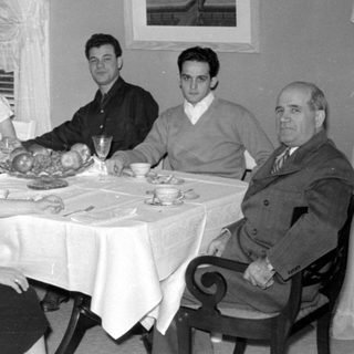 Family dinner scene, mid-20th century