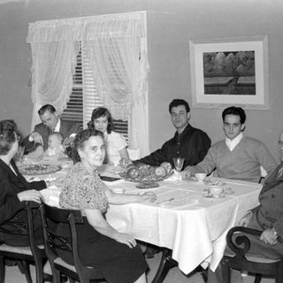 Family dinner scene, mid-20th century