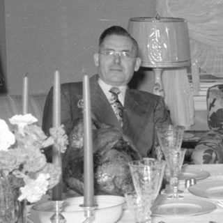 formal dining table with seated man