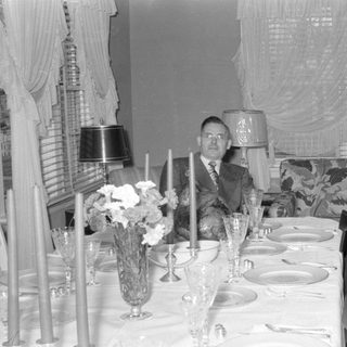 formal dining table with seated man
