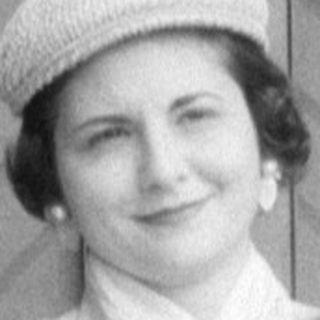 Woman and two children in formal mid-century attire.